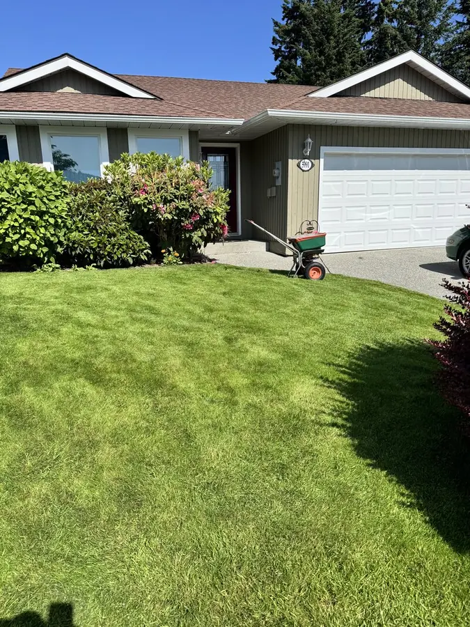 Beautiful residential home with lush green lawn maintained by Elite